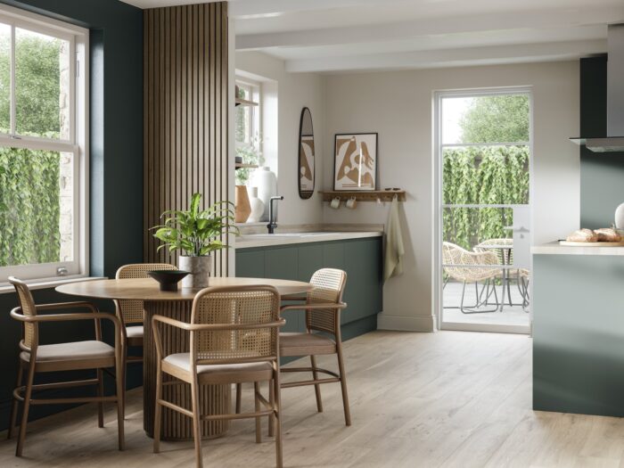 Magnet Luna kitchen in Laurel green with circular dining table and screen