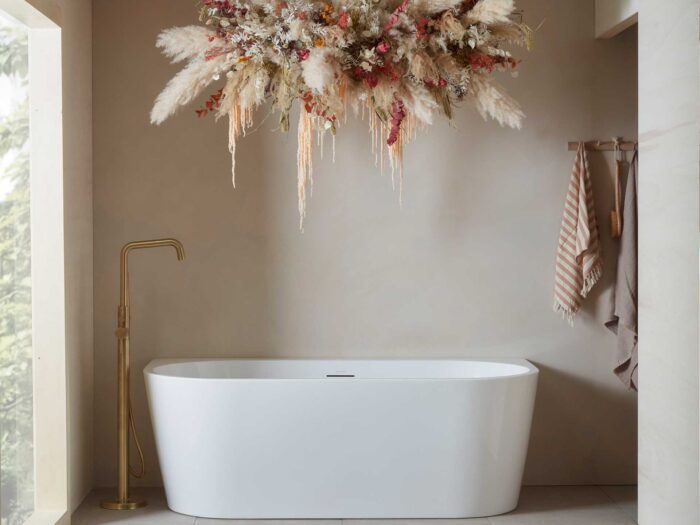Rhoper Rhodes back-to-wall baths look fab with a statement floral display above