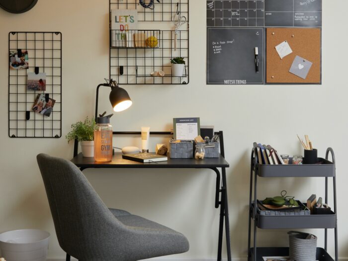 Student desk area with trolley and wall storage