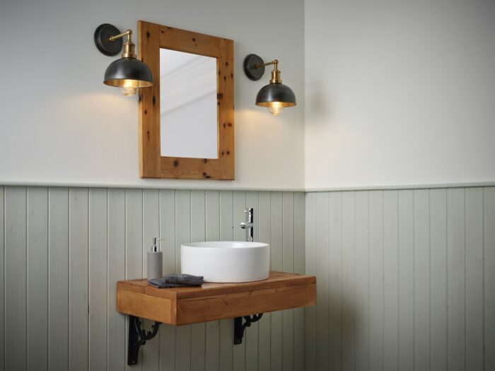 Bathroom basin and mirror with sage wall panels and