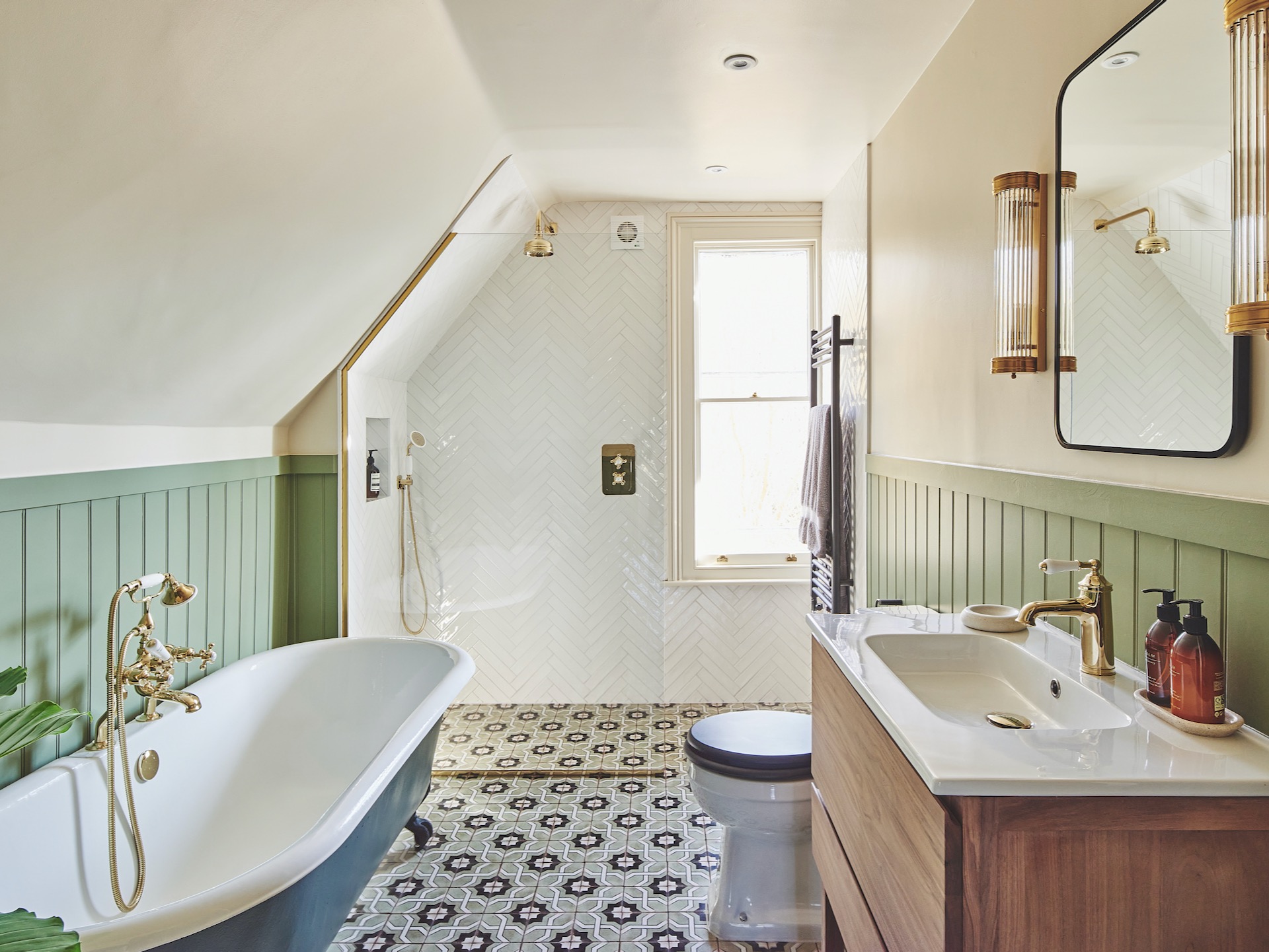 Attic bathroom with patterned tile floor, walk-in shower and green panelling