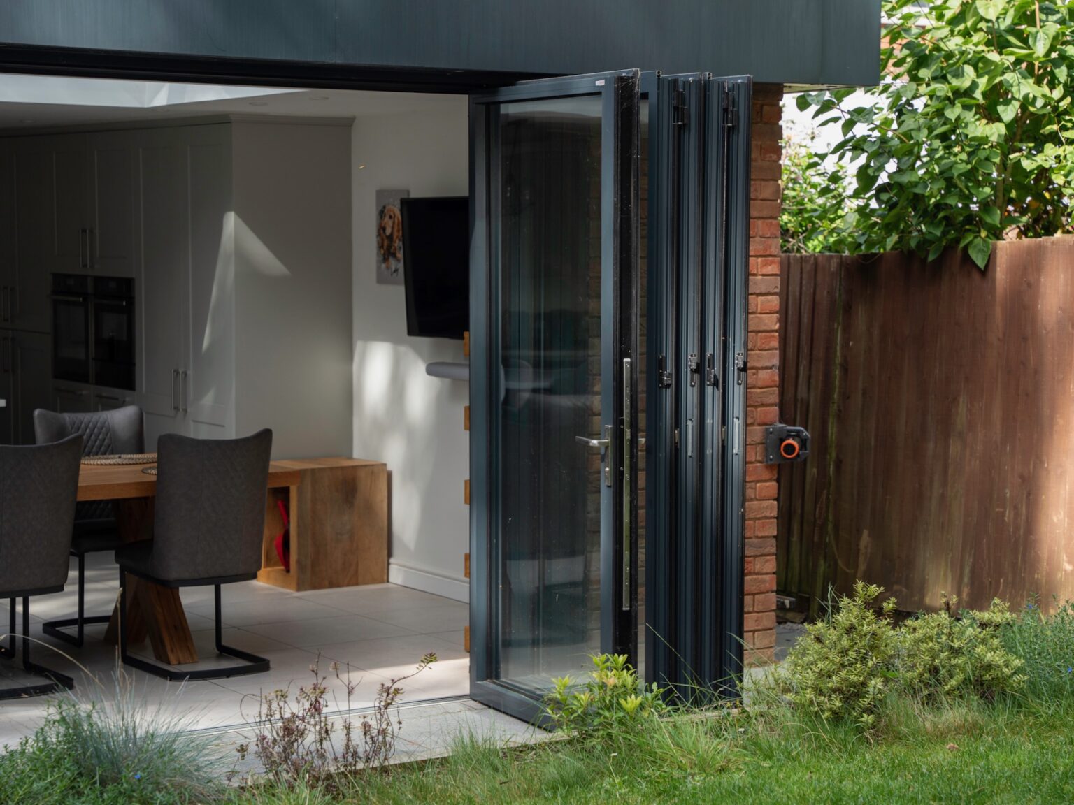 Sliding vs bi-fold doors: Pros and cons of these two glazing options ...