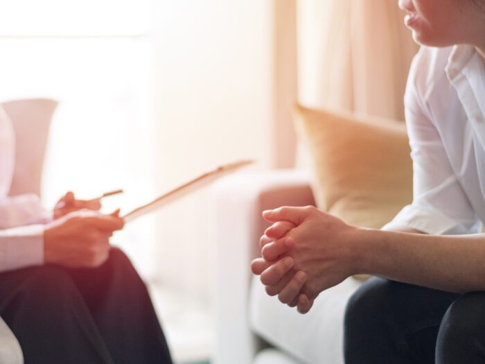 two people in a therapy session