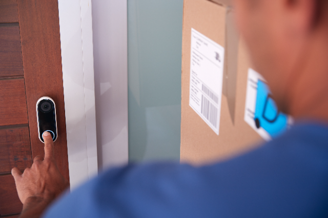 delivery driver arriving at Aldi video doorbell home
