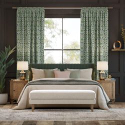 Green curtains in neutral bedroom space