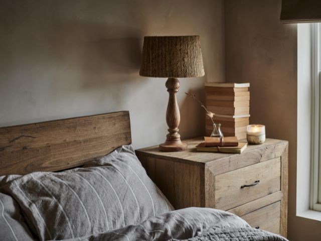cosy bedroom with candle by Nkuku