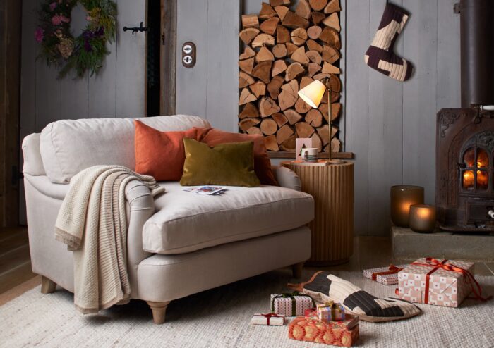 Cosy armchair by a wood fire