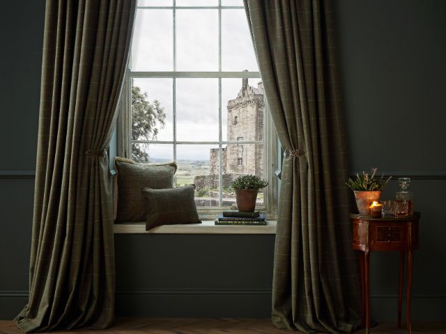 Heavy curtains in a green room