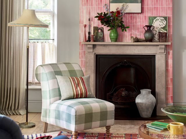 hecked accent chair with pink tiled fireplace by DFS