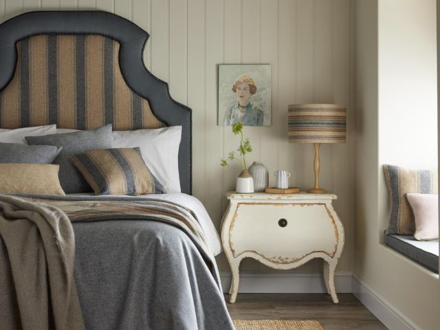 Striped blue and white bedroom with a coastal theme by MOON