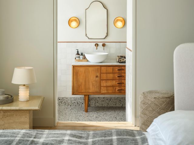 Layered lighting in a bathroom and bedroom by Industville