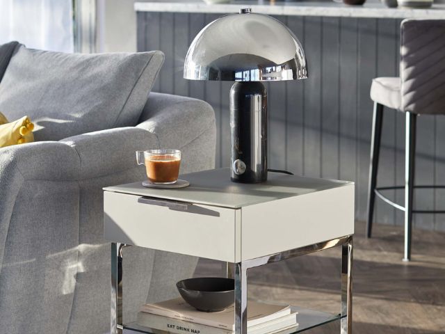 Chrome lamp on side table with chrome legs