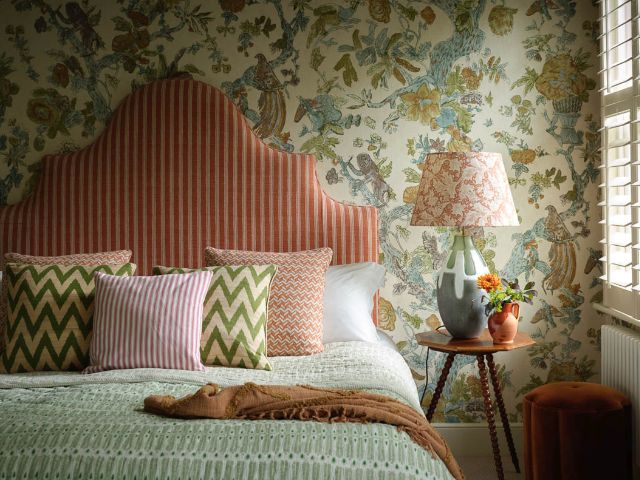 Beautifully made bed with a Pooky lamp