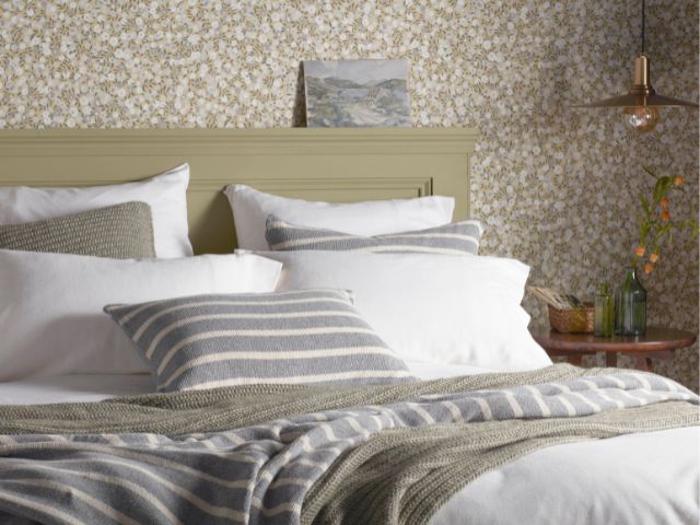 Layered bed in green tones by Secret Linen Store