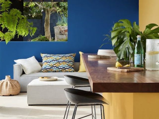 Colourful outdoor kitchen and seating area by Little Greene
