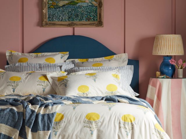 Colourful bedroom with white floral bedding by Secret linen store