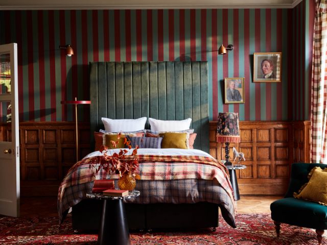 Panelled bedroom with striped wallpaper