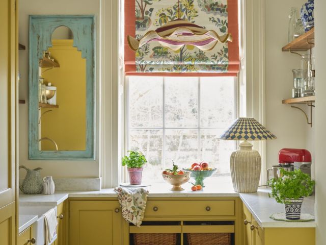 yellow kitchen with layered lighting