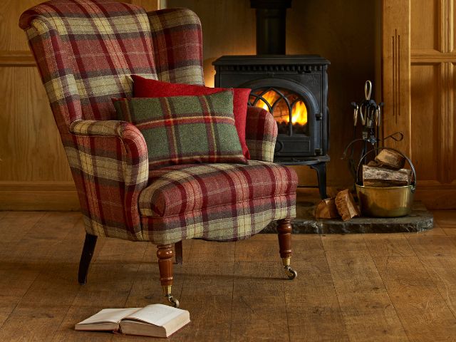 Tartan chair by a fireplace